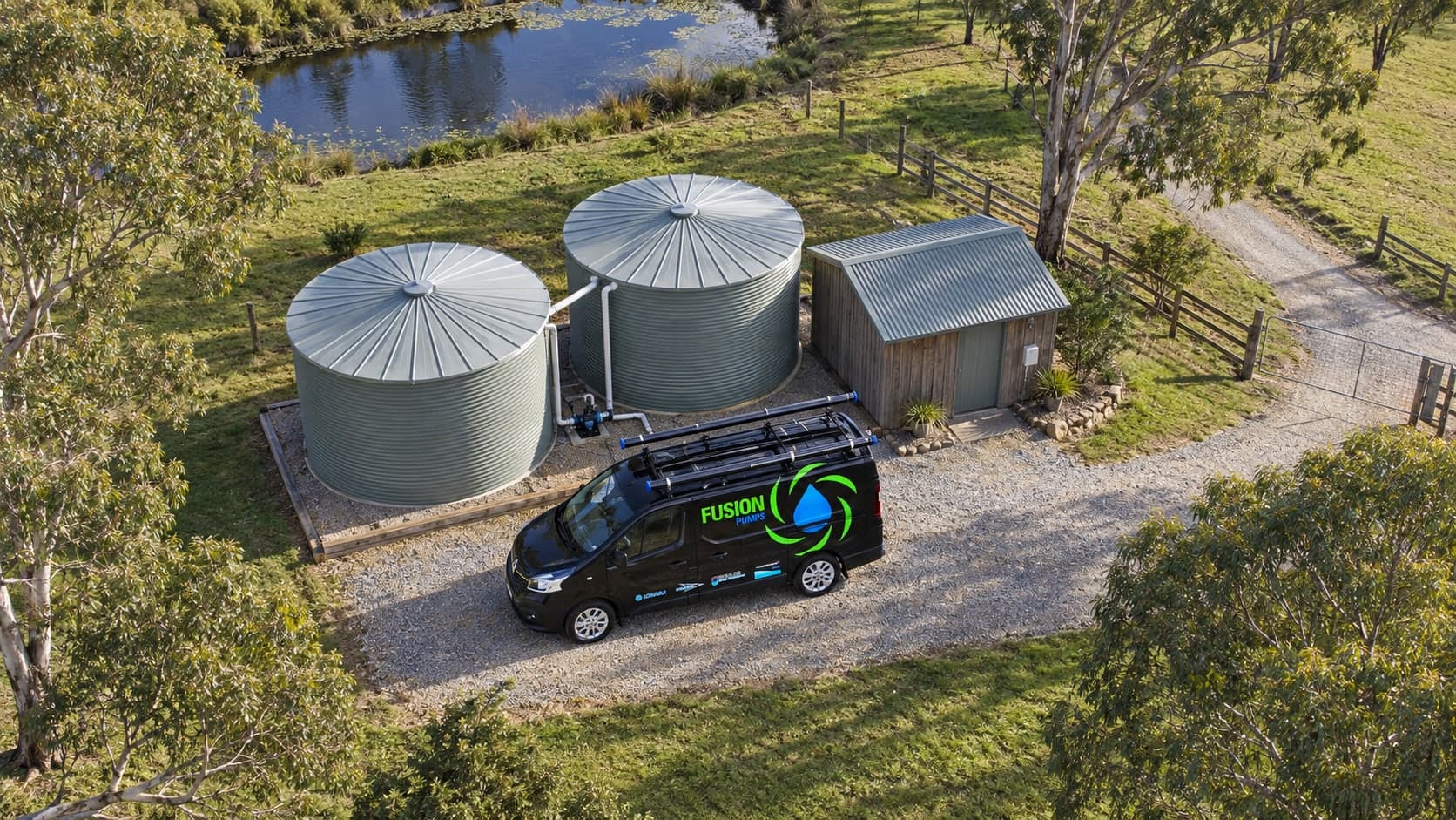 Aerial view of a Fusion Pumps van beside water tanks and their pressure pump