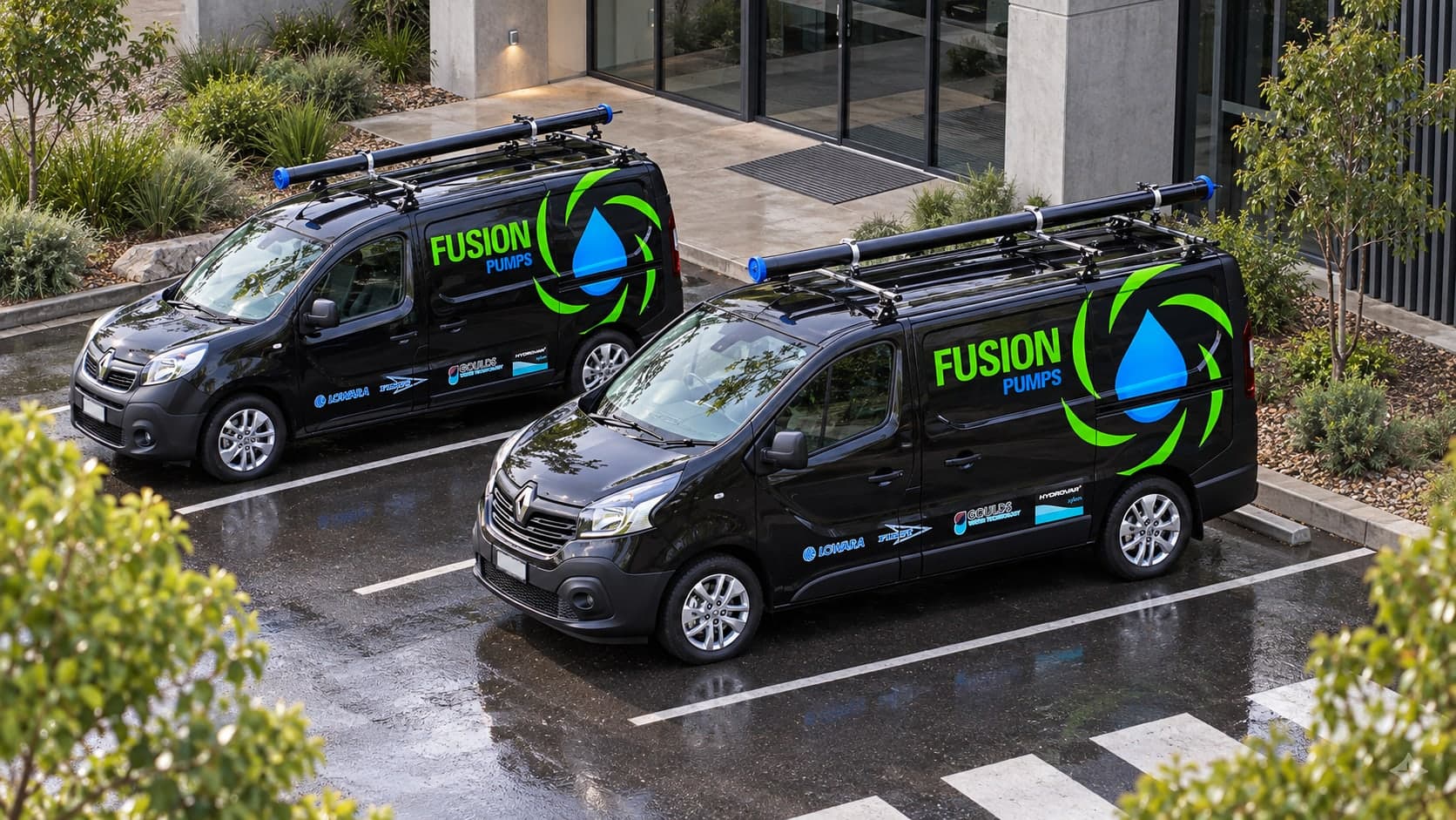 Two Fusion Pumps service vans outside a modern commercial building